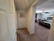 Hallway view into the main bedroom with neutral paint and carpet at 6656 Fort William St, North Las Vegas, NV 89084