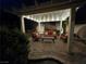 Pergola with outdoor furniture and string lights on a brick paver patio at 6656 Fort William St, North Las Vegas, NV 89084