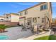 Well-designed backyard offers a cozy patio area with comfortable seating at 7078 Seabirds Pl, North Las Vegas, NV 89084