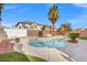 Backyard oasis features a pool, spa, and low-maintenance landscaping at 7078 Seabirds Pl, North Las Vegas, NV 89084