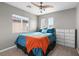 Bright bedroom with comfortable bedding, natural light and ceiling fan at 7078 Seabirds Pl, North Las Vegas, NV 89084