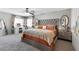 Spacious bedroom with plush carpeting, large bed and eye catching decorations at 7078 Seabirds Pl, North Las Vegas, NV 89084