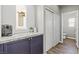 This convenient coffee bar includes stylish cabinetry, a window, and easy access to the powder room at 7078 Seabirds Pl, North Las Vegas, NV 89084