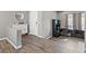 Inviting entryway with wood-look tile flooring and a functional workspace at 7078 Seabirds Pl, North Las Vegas, NV 89084