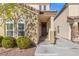 Charming entryway featuring a wreath on the front door and neat landscaping at 7078 Seabirds Pl, North Las Vegas, NV 89084