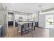Bright open kitchen with a large island, stainless steel appliances, and access to the backyard at 7078 Seabirds Pl, North Las Vegas, NV 89084