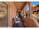 Relaxing balcony with outdoor seating and view of lush landscaping at 730 Hardy Way # A, Mesquite, NV 89027