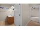 Bathroom featuring a double sink vanity with a walk-in door to the bedroom on neutral tiling at 730 Hardy Way # A, Mesquite, NV 89027