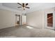 Bedroom boasts a tray ceiling, exterior access, and bathroom entrance at 730 Hardy Way # A, Mesquite, NV 89027