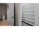 View of a large, organized walk-in closet with built-in shelving at 730 Hardy Way # A, Mesquite, NV 89027