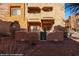 An exterior shot of a beautiful multi-story southwestern style home with desert landscaping at 730 Hardy Way # A, Mesquite, NV 89027