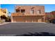 Charming two-story condo featuring a three car garage and desert landscaping at 730 Hardy Way # A, Mesquite, NV 89027