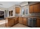Kitchen with stainless steel appliances, light wood cabinetry, and access to outside through sliding glass doors at 730 Hardy Way # A, Mesquite, NV 89027