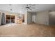Open-concept living area with tile floors, seamless transition to the kitchen, and modern lighting at 730 Hardy Way # A, Mesquite, NV 89027