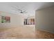 Spacious living room with tile flooring and a modern ceiling fan, perfect for relaxation at 730 Hardy Way # A, Mesquite, NV 89027