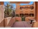 Relaxing outdoor patio and view of building exterior and greenery at 730 Hardy Way # A, Mesquite, NV 89027