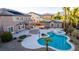 Aerial view of the resort-style backyard featuring a pool, spa, patio, and a pool house at 7338 Flying Pegasus Ct, Las Vegas, NV 89131
