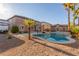 Beautiful backyard featuring a large pool and manicured landscaping at 7338 Flying Pegasus Ct, Las Vegas, NV 89131