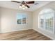 Bedroom showcasing tile flooring, plantation shutters, and ample natural light at 7338 Flying Pegasus Ct, Las Vegas, NV 89131