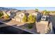 Front exterior of two-story home with an attached RV parking area at 7338 Flying Pegasus Ct, Las Vegas, NV 89131