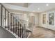 Inviting foyer with hardwood floors, staircase, and a decorative glass front door at 7338 Flying Pegasus Ct, Las Vegas, NV 89131