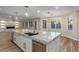 Stylish kitchen with granite countertops, stainless steel appliances, and center island perfect for entertaining at 7338 Flying Pegasus Ct, Las Vegas, NV 89131