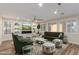 Bright living room with a decorative fireplace, recessed lighting, and stylish furniture at 7338 Flying Pegasus Ct, Las Vegas, NV 89131