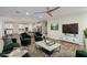 Open-concept living room with hardwood floors, modern decor, and an adjacent kitchen at 7338 Flying Pegasus Ct, Las Vegas, NV 89131