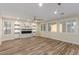 Spacious living room with a modern fireplace and custom shelving, filled with natural light at 7338 Flying Pegasus Ct, Las Vegas, NV 89131