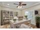 Home office featuring bright space, custom shelving and lots of natural light at 7338 Flying Pegasus Ct, Las Vegas, NV 89131