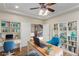 Bright and inviting office with custom built-in bookshelves and comfortable seating at 7338 Flying Pegasus Ct, Las Vegas, NV 89131