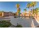 Relaxing backyard pool area featuring desert landscaping, palm trees, and a basketball hoop at 7338 Flying Pegasus Ct, Las Vegas, NV 89131