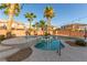 Backyard pool featuring a hot tub and palm trees at 7338 Flying Pegasus Ct, Las Vegas, NV 89131