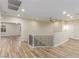 Upstairs landing with hardwood flooring and wrought iron railing at 7338 Flying Pegasus Ct, Las Vegas, NV 89131