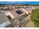 Aerial view of a single-Gathering home with solar panels, desert landscaping and tile roof at 7564 Wingspread St, North Las Vegas, NV 89084