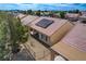 An aerial view shows the home's backyard, covered patio, and desert landscaping at 7564 Wingspread St, North Las Vegas, NV 89084