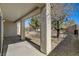 Covered back patio with view of landscaped backyard and decorative rock at 7564 Wingspread St, North Las Vegas, NV 89084