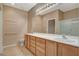 Bathroom with double sinks, vanity, and large mirror at 7564 Wingspread St, North Las Vegas, NV 89084