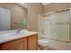 Bathroom features a single sink, toilet, and shower with glass enclosure at 7564 Wingspread St, North Las Vegas, NV 89084