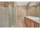 Bathroom with double sinks, vanity, and walk-in shower at 7564 Wingspread St, North Las Vegas, NV 89084