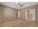 Spacious bedroom with tile flooring and attached bathroom at 7564 Wingspread St, North Las Vegas, NV 89084