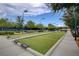 Outdoor bocce ball court surrounded by shade trees and seating at 7564 Wingspread St, North Las Vegas, NV 89084