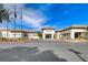A clubhouse entrance is well-maintained with landscaping, and presents an inviting entry for residents at 7564 Wingspread St, North Las Vegas, NV 89084