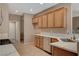 Bright kitchen features stainless steel appliances and quartz countertops at 7564 Wingspread St, North Las Vegas, NV 89084