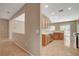 Open concept kitchen leads into additional living space at 7564 Wingspread St, North Las Vegas, NV 89084