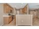 Open kitchen offers breakfast bar, granite countertops, and stainless steel appliances at 7564 Wingspread St, North Las Vegas, NV 89084