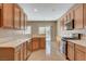 Open kitchen boasts stainless steel appliances and quartz countertops at 7564 Wingspread St, North Las Vegas, NV 89084
