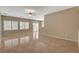 Open living room featuring tile floors, neutral walls, and lots of natural light at 7564 Wingspread St, North Las Vegas, NV 89084