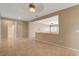 Open-concept area featuring neutral walls, tile floors, and views into other rooms at 7564 Wingspread St, North Las Vegas, NV 89084