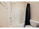 Bathroom featuring a tiled shower/tub combo, rainfall shower head, and neutral colors at 7649 Calico Fields St, Las Vegas, NV 89149